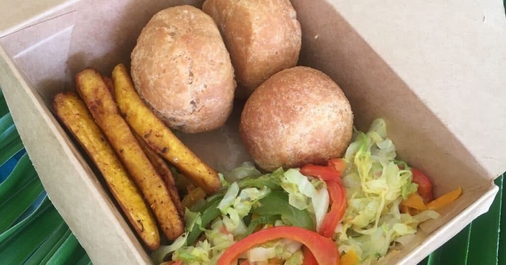Steam Cabbage, Fried Plantain and Fried Dumplings in Take Out Box
